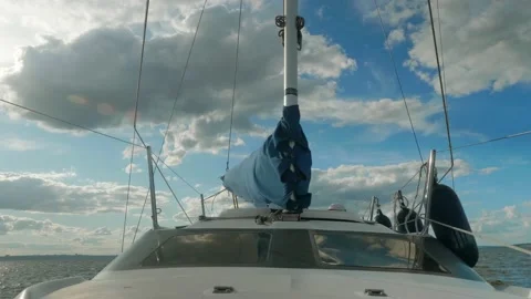 Eye angle view of mast with boom on it. Curtailed main sail is in hood. White Stock Footage 142268743