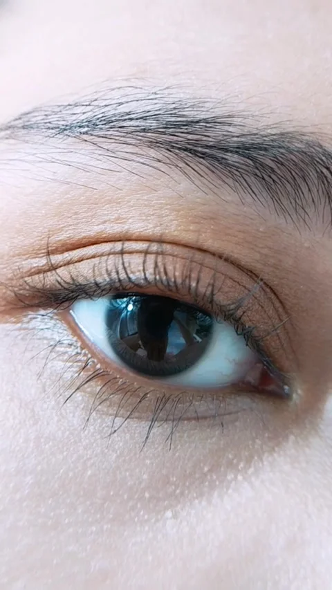 Eye blinking captured in vertical close up. Suitable for beauty eyelash or .. Stock Footage 340360661