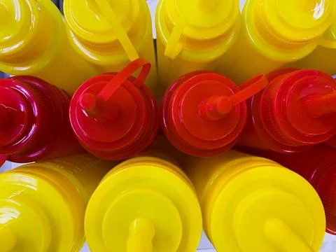 Eye-Catching Flat Lay Composition of Assorted Red and Yellow Sauce Bottles Stock Photos