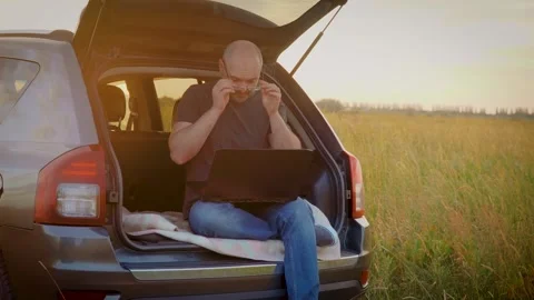 Eye diseases, vision problems, oculistica - concentrated man using laptop Stock Footage 245445537