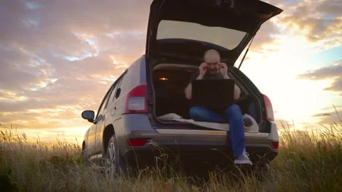 Eye diseases, vision problems, oculistica - concentrated man using laptop Stock Footage 248692643