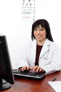 Eye doctor at computer Stock Photos