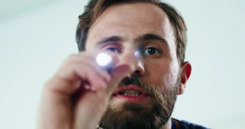 Eye exam, light and doctor with face of man in hospital for pupil reflex, Stock Footage 326438865