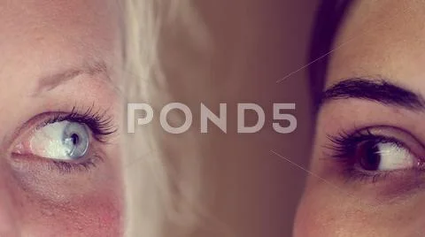 Eye-to-eye and face-to-face blonde and brunette women Stock Photos