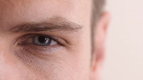 Eye, face and vision with person in studio for optometry, eyesight exam or Video stock 334538461