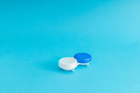 Eye lens case on blue background Stock Photos