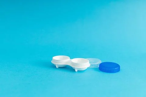 Eye lens case on blue background Stock Photos