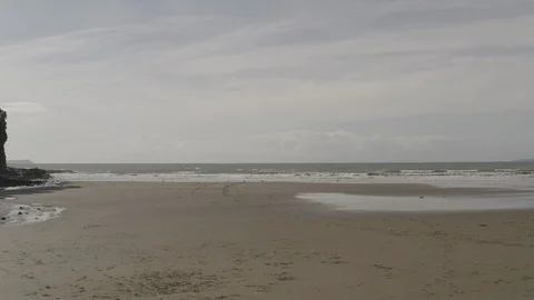 Eye-level POV sprint from sandy beach into water 4K HDR Stock Footage 113899017