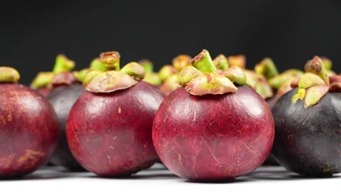 Eye Level Rotating Shot Of Fresh Mangosteens In Row Stock Footage 336226592