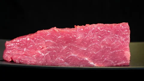 Eye-Level Shot of Fresh Raw Beef Tenderloin Rotating Stock Footage 343257546