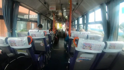 Eye level view of a bus ride in Ginowan Okinawa Japan circa March 10 2019 Stock Footage 108672680