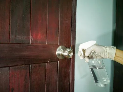 Eye-level view, clean stainless steel doorknob (wood door) 스톡 사진