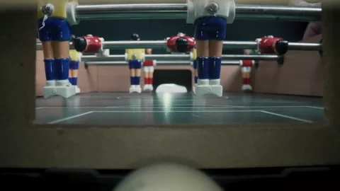 Eye level view of foosball going into the goal Stock Footage 260873402