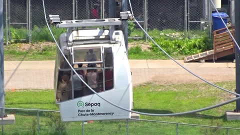 Eye level view of Sepaq cable car carrying tourists at Parc de la Chute-Montmore 動画素材 341716685