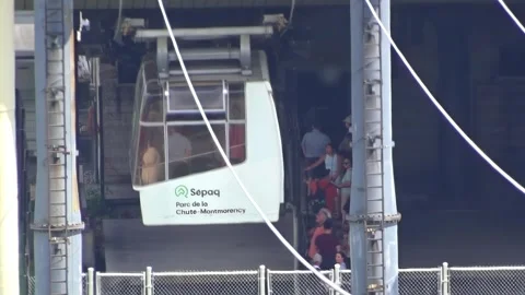Eye level view of Sepaq cable car carrying passengers at Parc de la Chute-Montmo 動画素材 341735629
