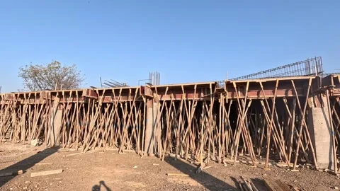 Eye level wide angle view capturing a complex wooden framework shoring system Stock Footage 337630634