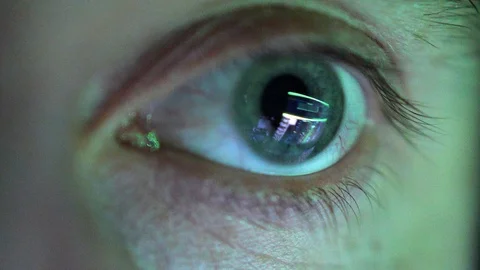 Eye Looking at Computer Screen Programming Hacker Code Reflecting in Eyeball Video stock 106400434