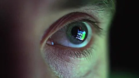 Eye Looking at Computer Screen Programming Hacker Code Reflecting in Eyeball Stock Photos
