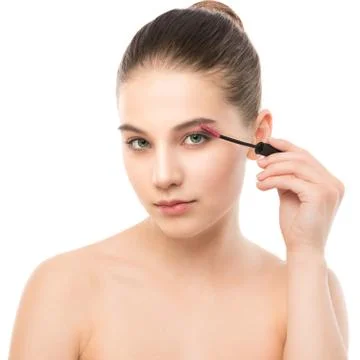 Eye make up apply. Mascara applying closeup, long lashes. makeup brush. Isolated Stock Photos