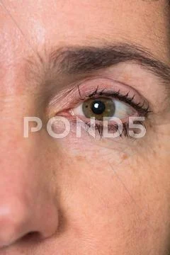 Eye of a mature woman with wrinkles Stock Photos