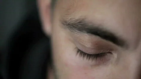 An eye opens and looks up at camera Stock Footage 400112