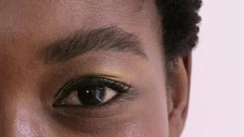 Eye, optometry and face of black woman in studio with eyesight, vision or Video stock 334759631