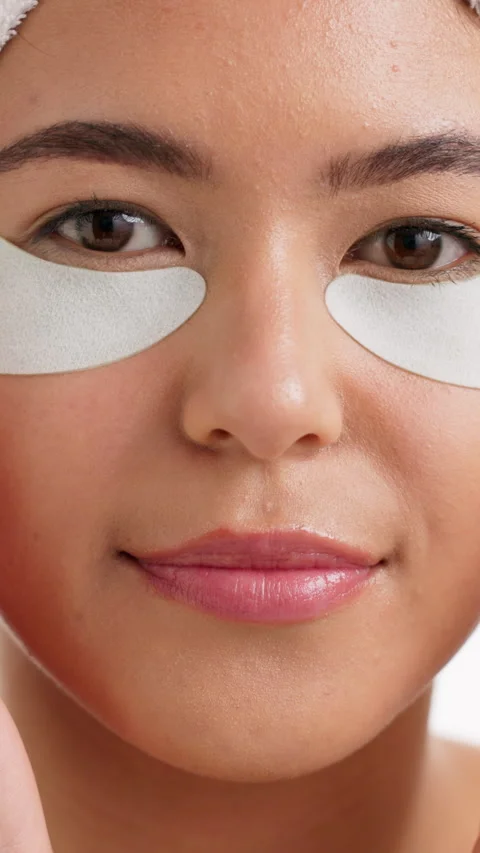 Eye patch, cosmetics and face with woman for self care, beauty and skincare Stock Footage 333704664