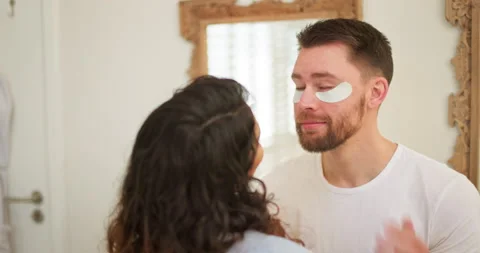 Eye patch, skin care and happy couple in home bathroom together for facial Vídeos de archivo 231756994