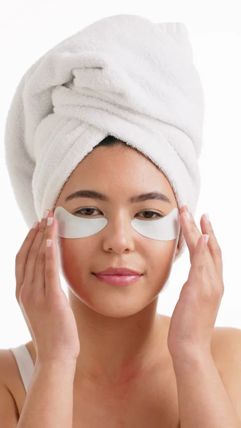 Eye patch, skincare and face with woman in studio for self care, cosmetics or Stock Footage 333700450