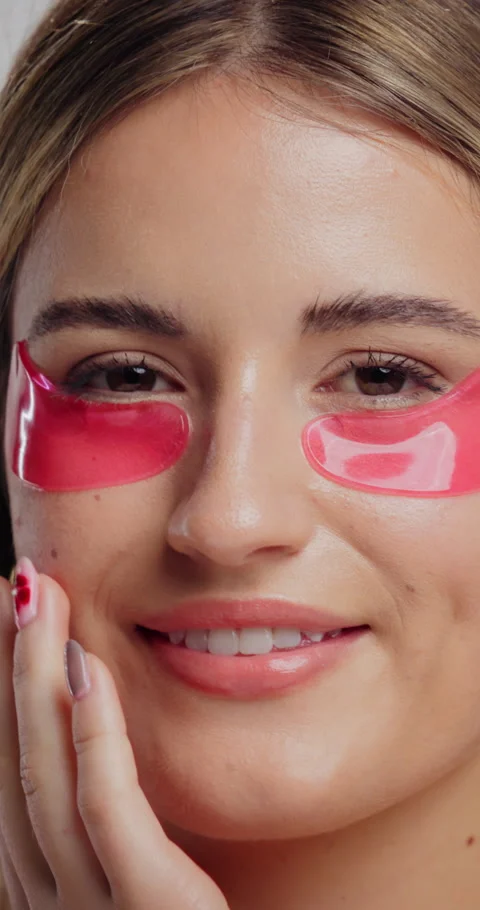 Eye patch, smile and face of woman for fine line treatment, hyaluronic acid or Stock Footage 334016283