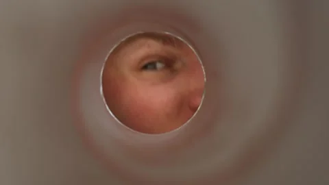 Eye peeks into chip tube Stock Footage 337160555