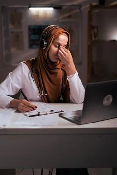 Eye problem concept. Fatigue Muslim woman doctor irritated rubbing nose Stock Photos