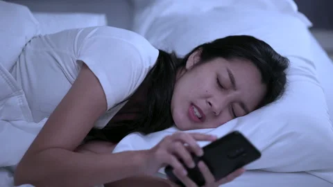  Eye problems caused by lifestyle of young female using mobile phone to network. Video stock 169834870