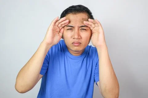 Eye problems man holding glasses and squinting eyes Stock Photos