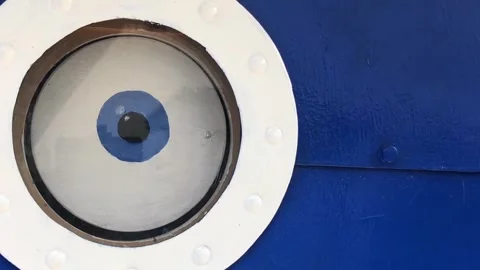 An eye in a round window in the form of a porthole Stock Footage 279249942