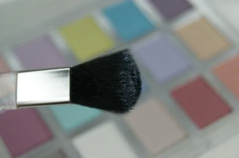 Eye shadow on a brush close up. Stock Photos
