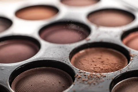 Eye shadow is close. A makeup brush with eye shadow on it scatters the grains Stock Photos