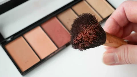 Eye shadows in brush in hand,  Set Of Cosmetic Makeup Products. Nail polish,  Stock Footage 153107424