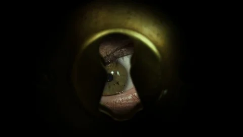 Eye spying through the keyhole Stock Footage 96679862