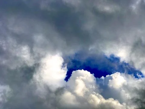 Eye of the storm: clouds in the blue sky Stock Photos