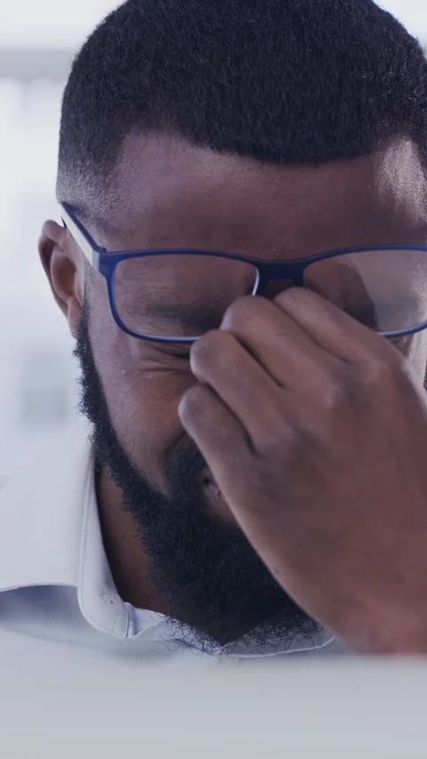 Eye strain, glasses or black man in office with laptop, tired or headache in Stock Footage 324187670