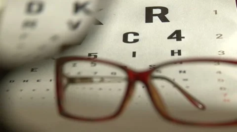 Eye test and red eyeglasses Stock Footage 7753457