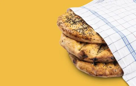 Eye view concept image of round breads isolated on yellow background. Stock Photos