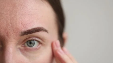 Eyebrow after permanent makeup. Closeup. 4K Stock Footage 322028686