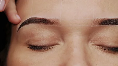 Eyebrow coloring. Professional lamination procedures of female eyebrows in be Stock Footage 219933848