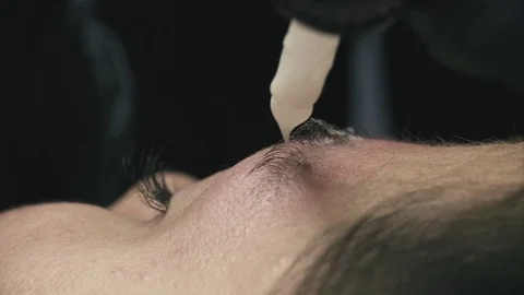 Eyebrow correction in beauty clinic Stock Footage