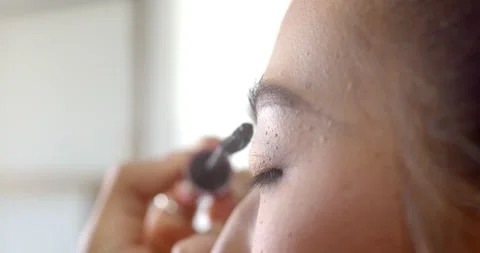 Eyebrow gel is applied to the eyebrows and then combed to make the eyebrows easy Stock Footage 222740852