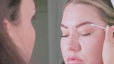 Eyebrow grooming is done with precision, essential for any modern beauty routine Video stock 315859842