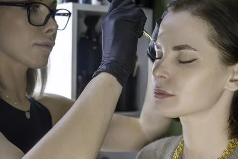 Eyebrow lamination procedure styling, correction, coloring and in beauty salon Stock Photos