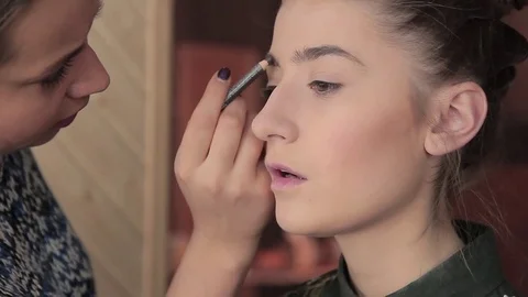 Eyebrow makeup for model in preparation for photography Stock Footage 72602162